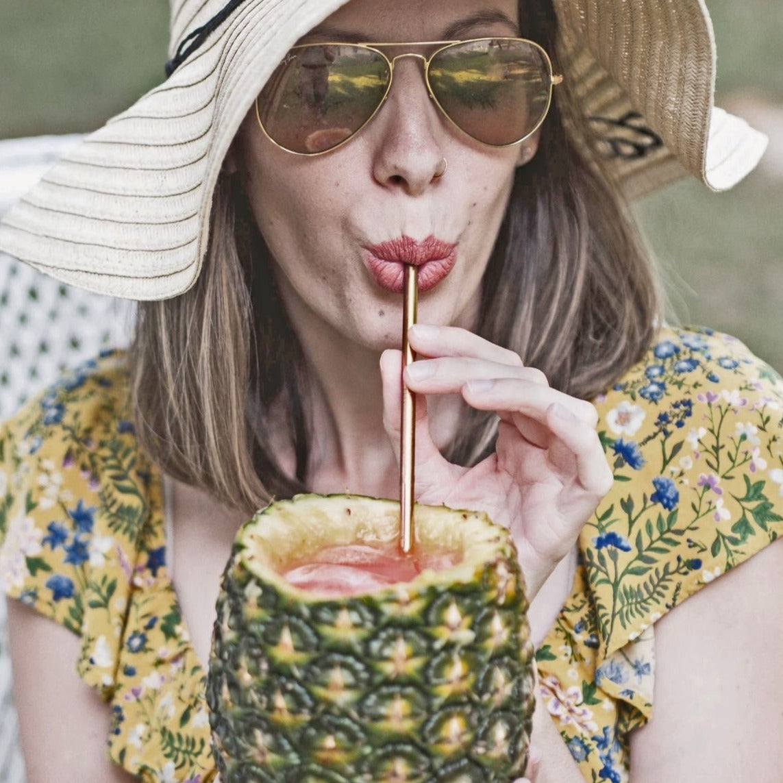 A colorful set of stainless steel straws with a cleaning tool and a drawstring bag, promoting eco-friendliness and humor.