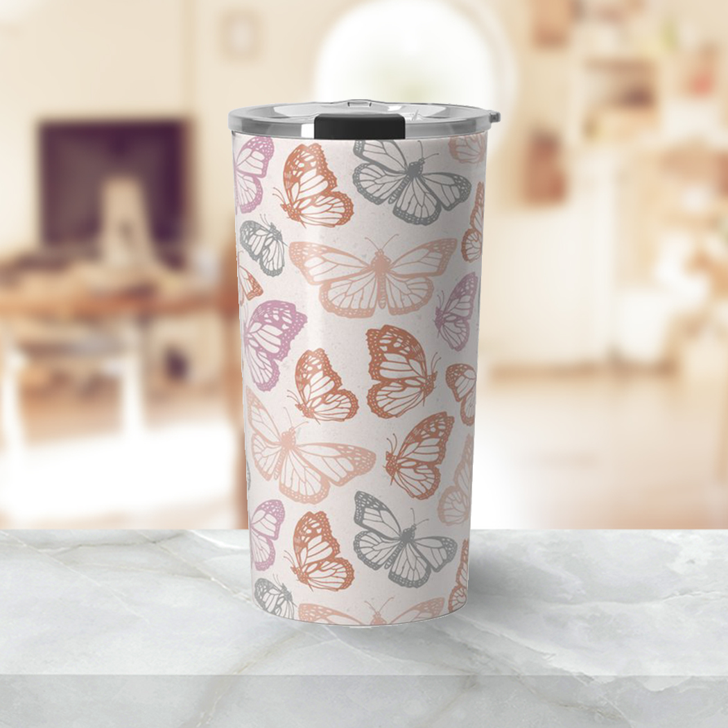 Orange and pink travel coffee mug featuring a butterfly design, made of stainless steel with a double-wall insulation.