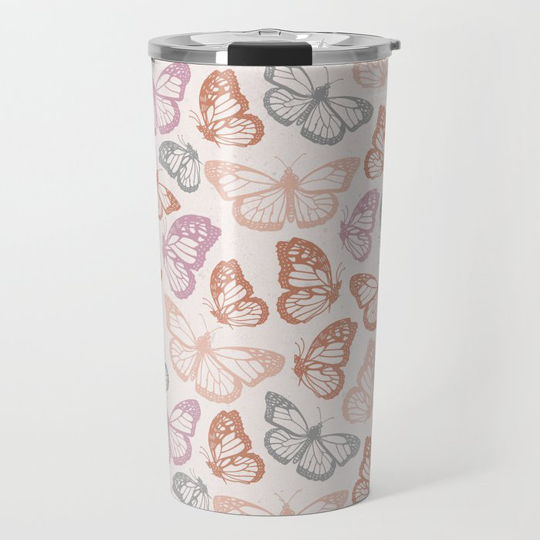 Orange and pink travel coffee mug featuring a butterfly design, made of stainless steel with a double-wall insulation.