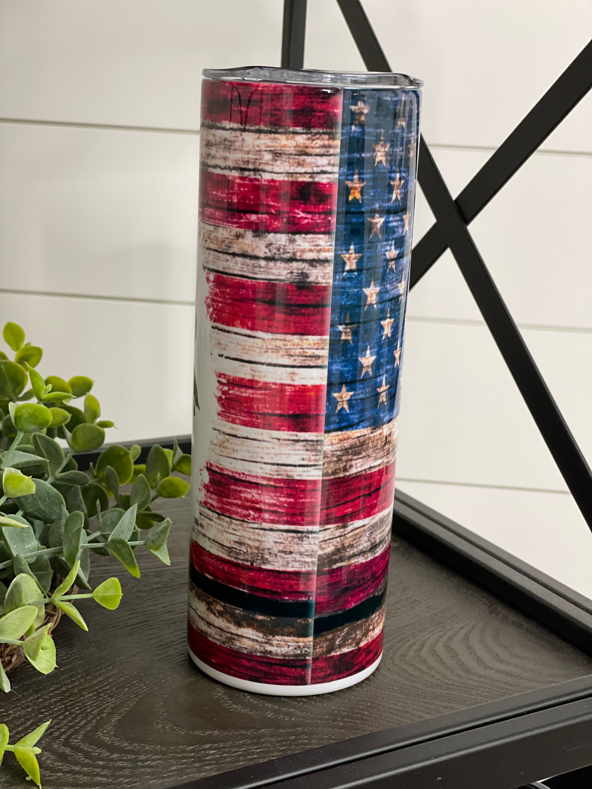 Patriotic Messy Bun 20oz Skinny Tumbler with vibrant design and reusable straw.