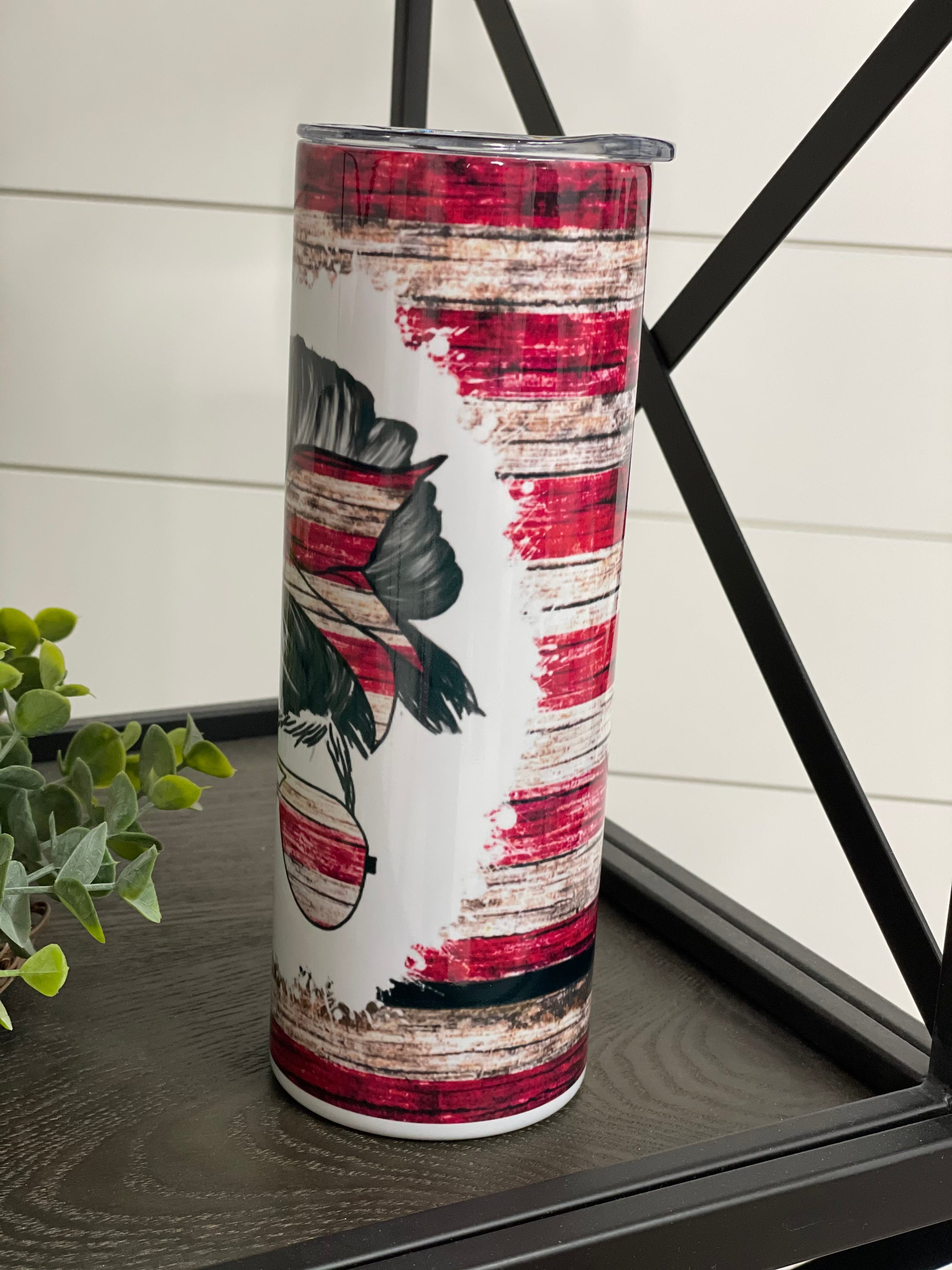 Patriotic Messy Bun 20oz Skinny Tumbler with vibrant design and reusable straw.