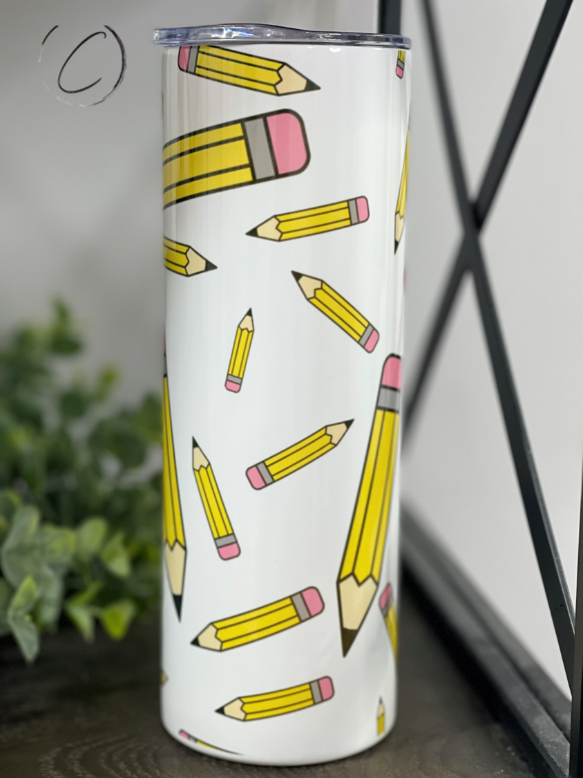 Pencils 20oz Skinny Tumbler with a vibrant full wrap design, featuring a reusable straw and a sleek, insulated body.