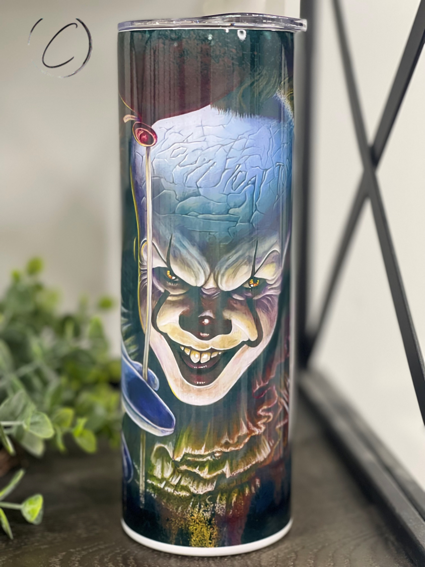 Pennywise Bloody Paper 20oz Skinny Tumbler featuring a vibrant horror-themed design, complete with a reusable straw.