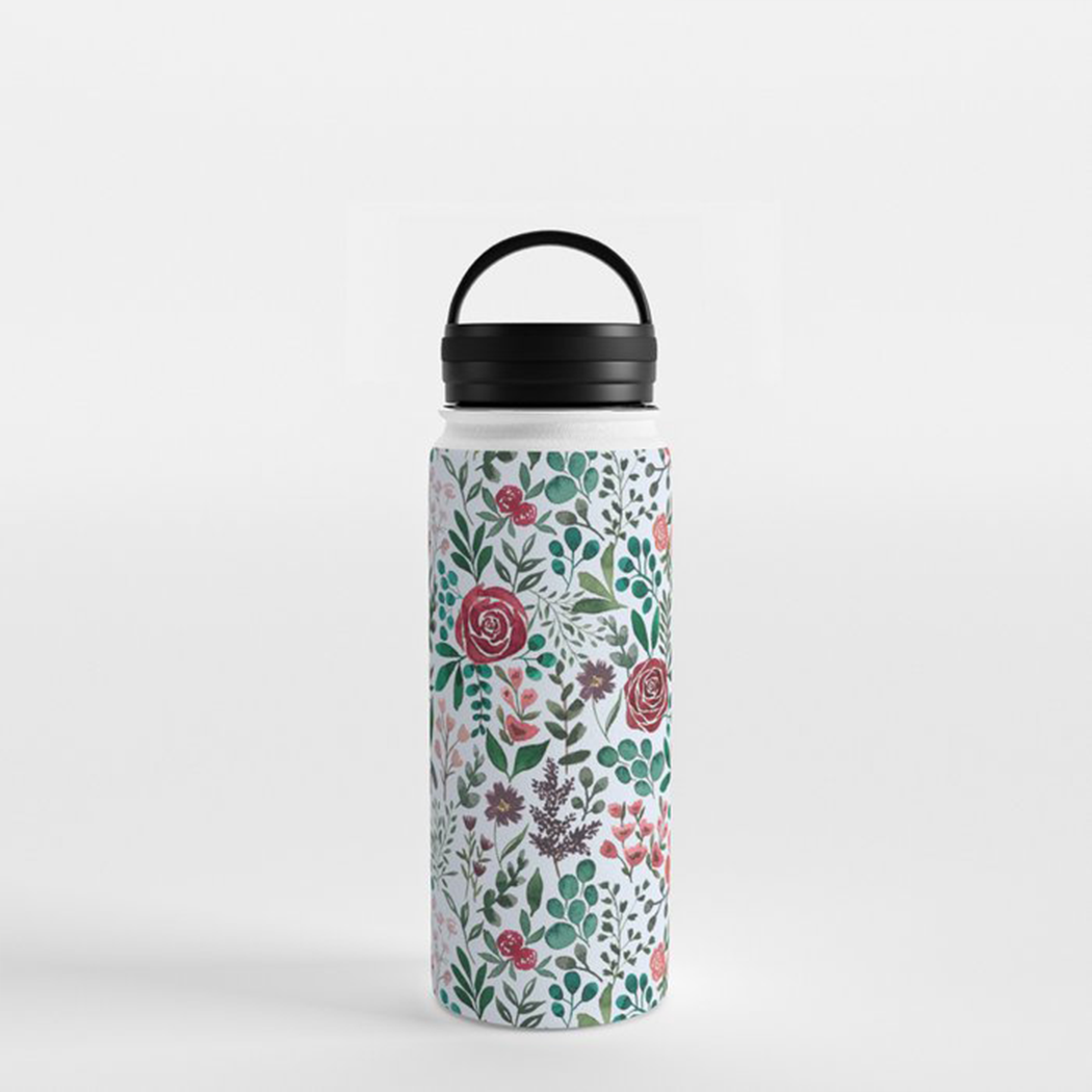 Pink and purple floral stainless steel water bottle with handle lid, showcasing its stylish design and durable construction.