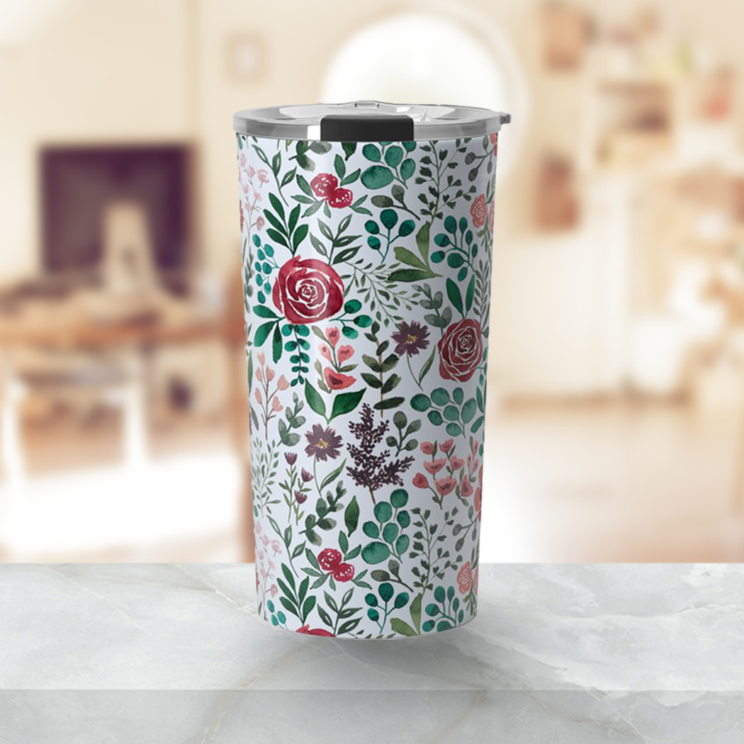 A stylish travel mug featuring a vibrant pink and purple floral design, made of stainless steel with a double-walled construction.