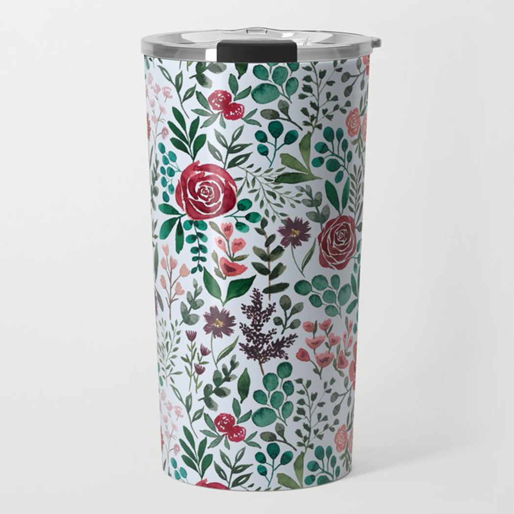 A stylish travel mug featuring a vibrant pink and purple floral design, made of stainless steel with a double-walled construction.