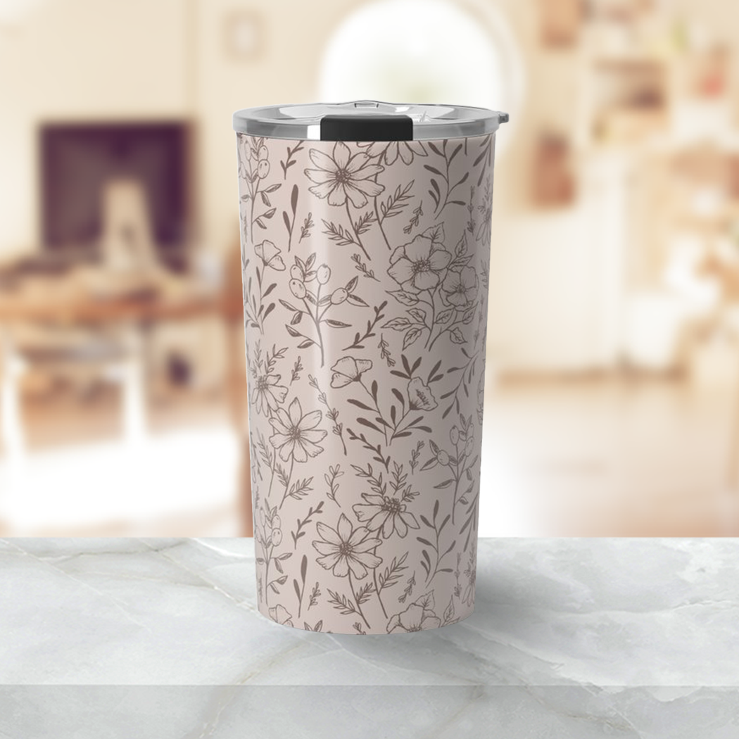 A stylish pink flower travel mug made of stainless steel, featuring a vibrant floral design and a vacuum-sealed lid.