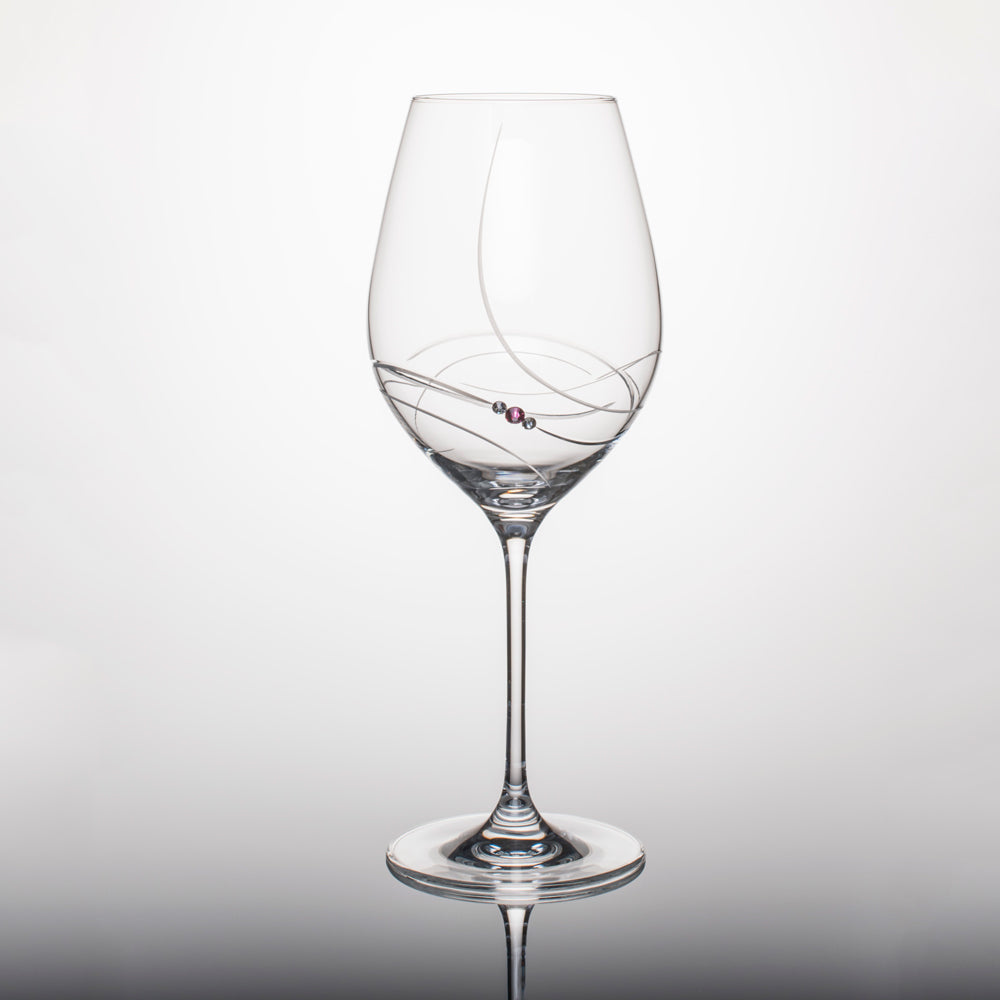 Set of two elegant pink ribbon red wine glasses with Swarovski crystals in a gift box, showcasing handcrafted lead-free crystal design.