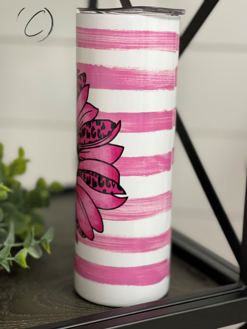 Pink Ribbon Sunflower 20oz UV Pink Skinny Tumbler with a vibrant sunflower design and a color-changing effect in sunlight.