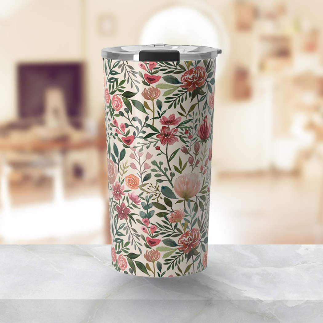 A stylish 20oz travel mug featuring vibrant pink spring flowers design, made of durable stainless steel with a double-walled structure.