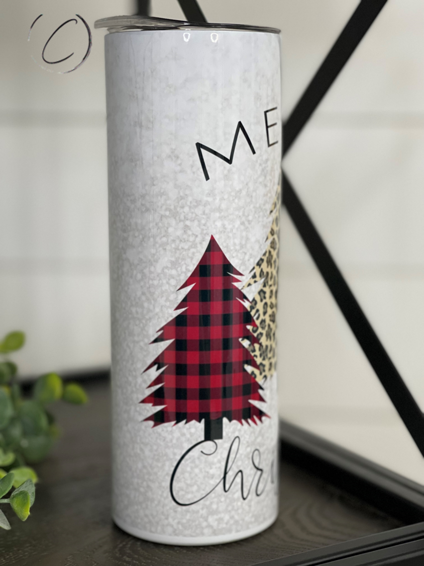 Plaid and leopard patterned 20oz skinny tumbler with a straw, featuring Merry Christmas trees design.