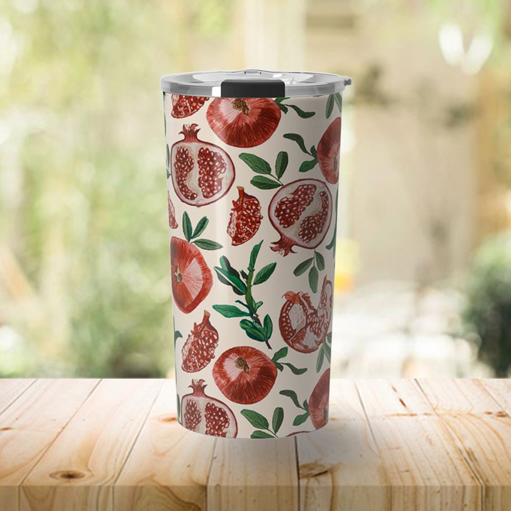 A stylish 20oz Pomegranate Travel Mug made of stainless steel with vibrant wraparound artwork, perfect for hot and cold beverages.