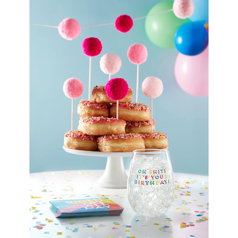 Set of 6 colorful pom pom cake toppers in red, hot pink, and light pink, perfect for birthday celebrations.