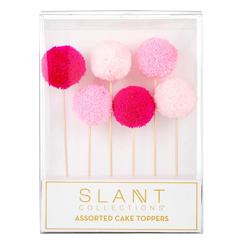 Set of 6 colorful pom pom cake toppers in red, hot pink, and light pink, perfect for birthday celebrations.