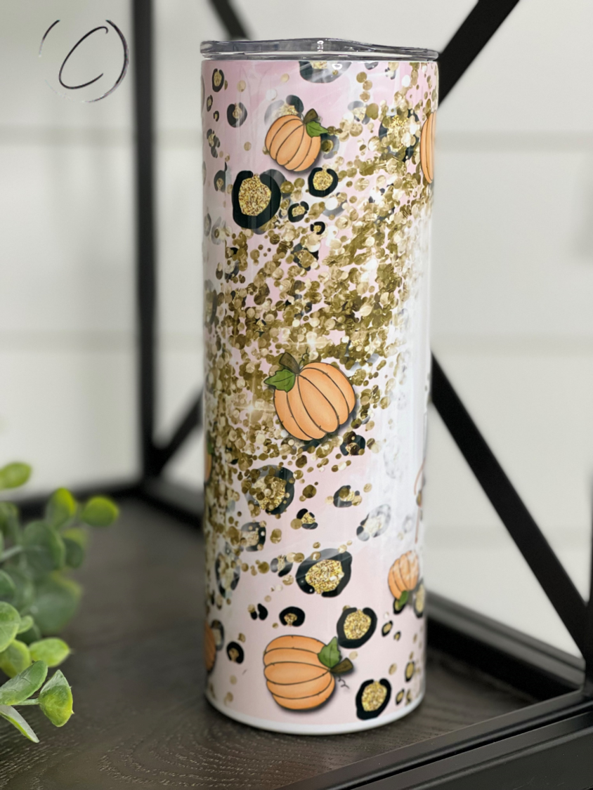 Pumpkin Spice Junkie 20oz Skinny Tumbler featuring a vibrant pumpkin spice design, complete with a reusable straw.