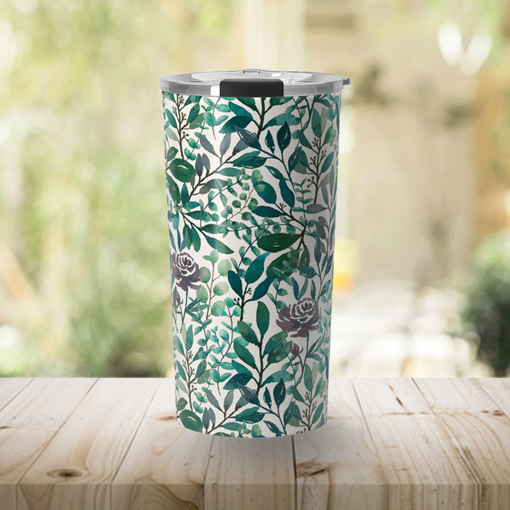 A stylish travel mug featuring purple flowers and eucalyptus leaves design, made of stainless steel with a double-wall for insulation.