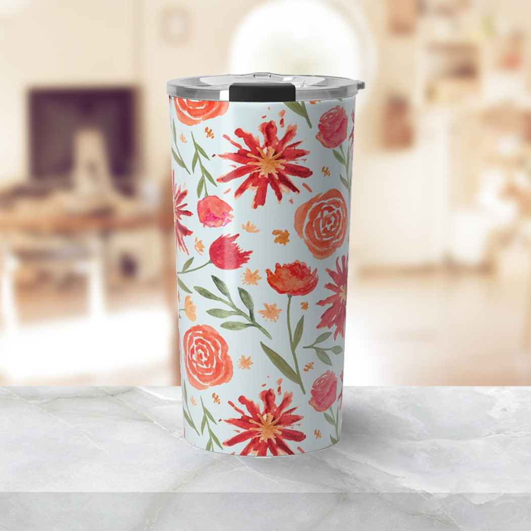 A vibrant Red Flower Burst Travel Coffee Mug made of lightweight stainless steel with a double-walled design, featuring beautiful floral artwork.