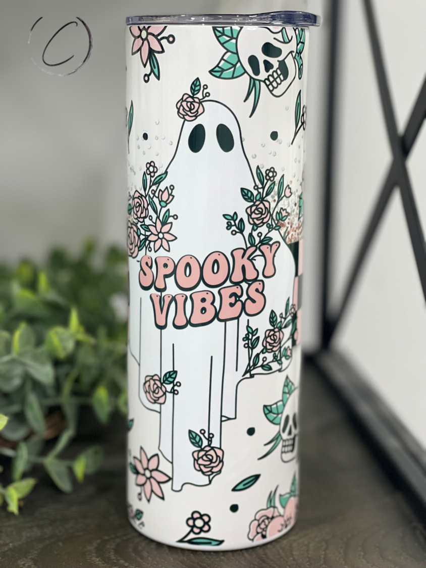 A stylish 20oz skinny tumbler featuring a vibrant retro spooky design, perfect for Halloween enthusiasts.