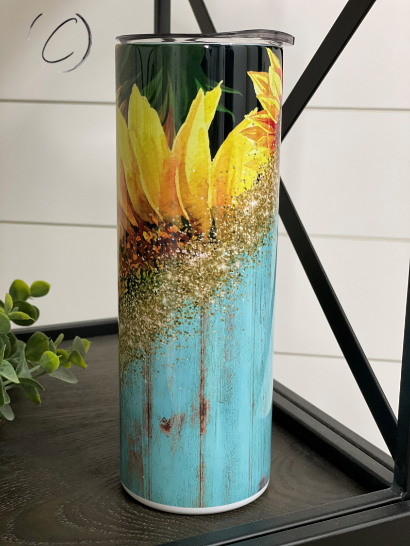 Rustic Sunflower 20oz Skinny Tumbler with a vibrant sunflower design, perfect for hot and cold beverages.