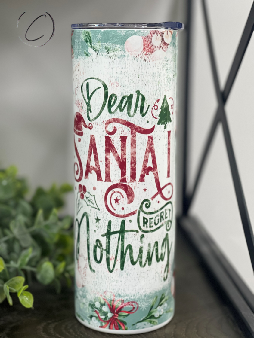 Santa I Regret Nothing 20oz Skinny Tumbler with festive design and reusable straw.