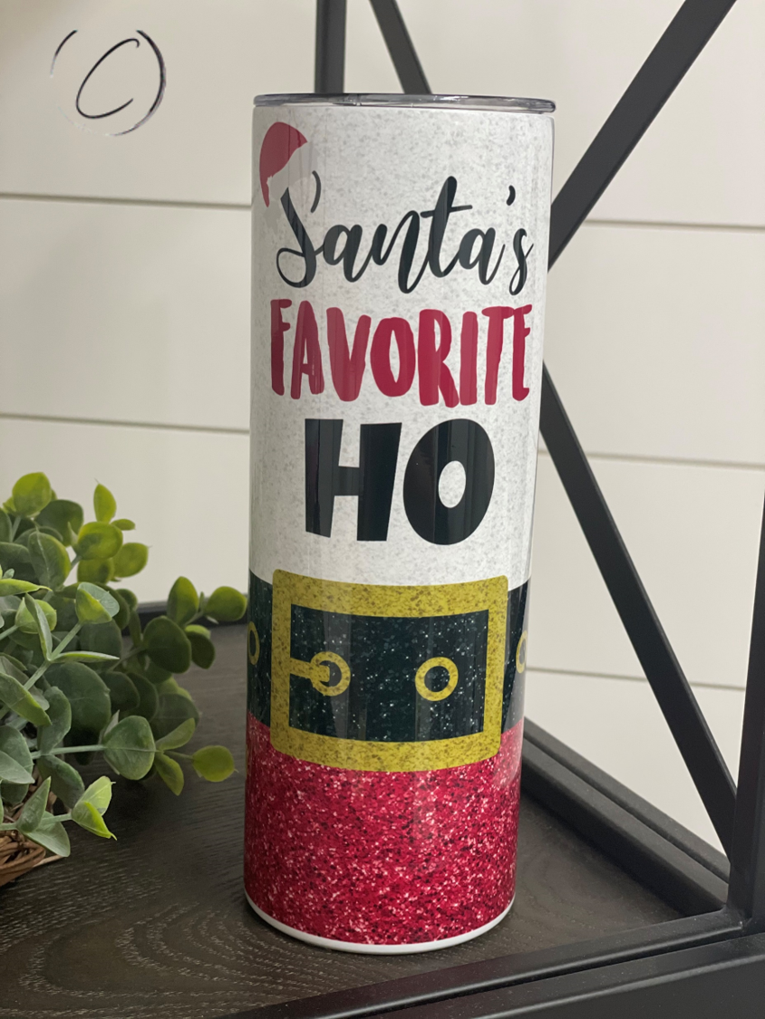 Santa's Favorite Ho 20oz Skinny Tumbler with festive design and reusable straw.