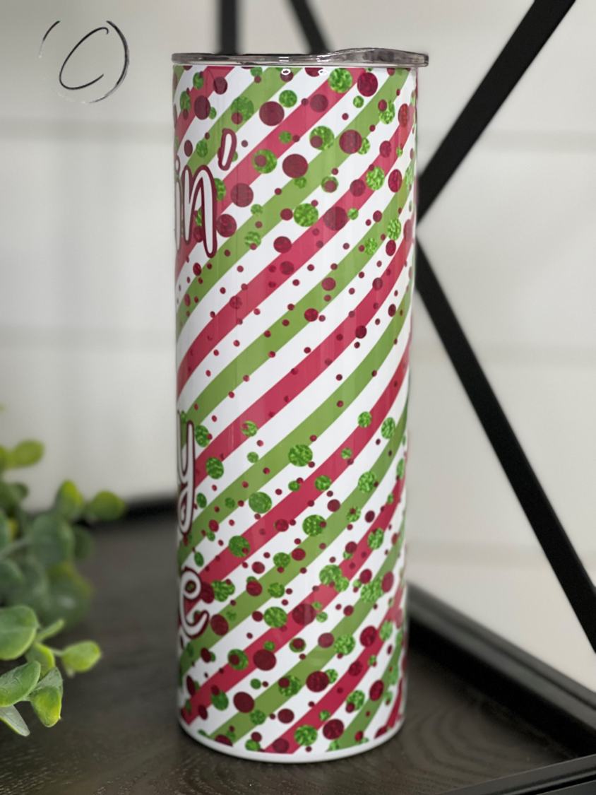 Sippin' On Jolly Juice 20oz Skinny Tumbler with vibrant full wrap design and reusable straw.