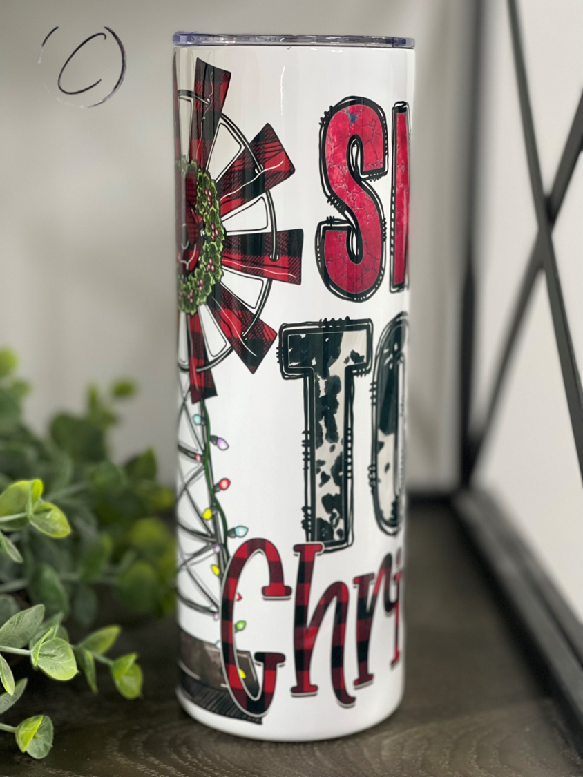 Small Town Christmas 20oz Skinny Tumbler featuring a festive design, perfect for holiday beverages.