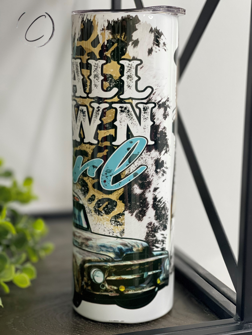 Small Town Girl Water Tower 20oz Skinny Tumbler with a charming water tower design, featuring a reusable straw.