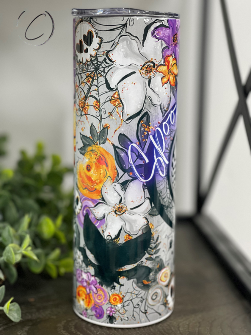 Spooky Vibes 20oz Skinny Tumbler featuring a full wrap Halloween design with a reusable straw.