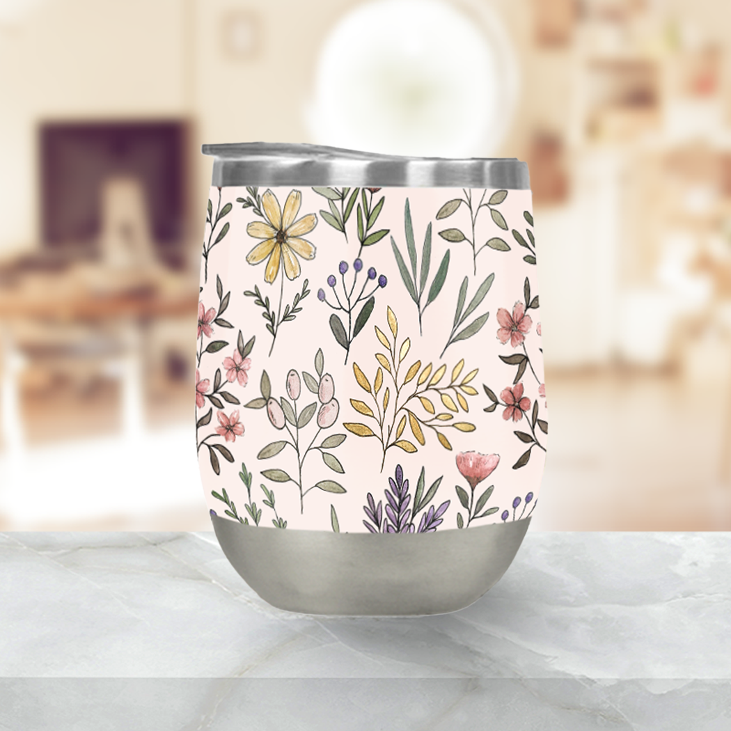 Spring Botanical Stemless Wine Tumbler with floral design, showcasing its stainless steel construction and plastic lid.