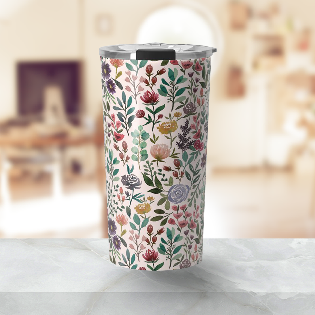 A stylish 20oz travel mug featuring a vibrant spring garden floral design, made of lightweight stainless steel with a vacuum-sealed lid.