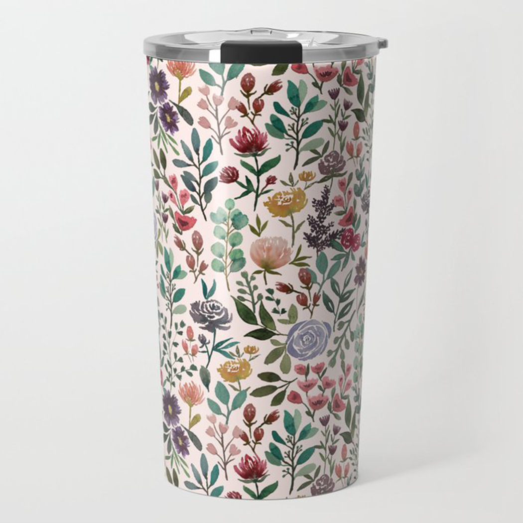 A stylish 20oz travel mug featuring a vibrant spring garden floral design, made of lightweight stainless steel with a vacuum-sealed lid.