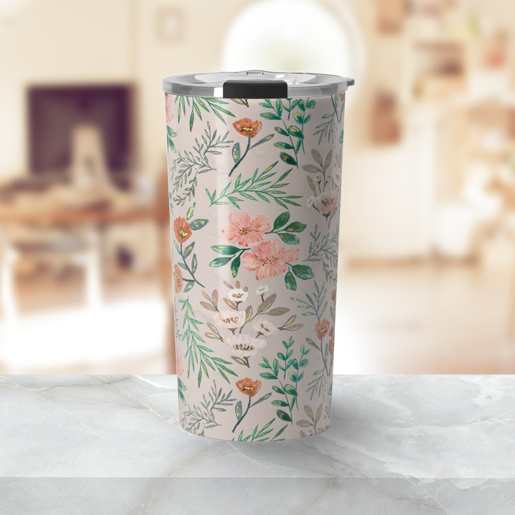 A stylish 20oz Springtime Travel Mug made of lightweight stainless steel with vibrant wraparound artwork, designed for hot and cold beverages.