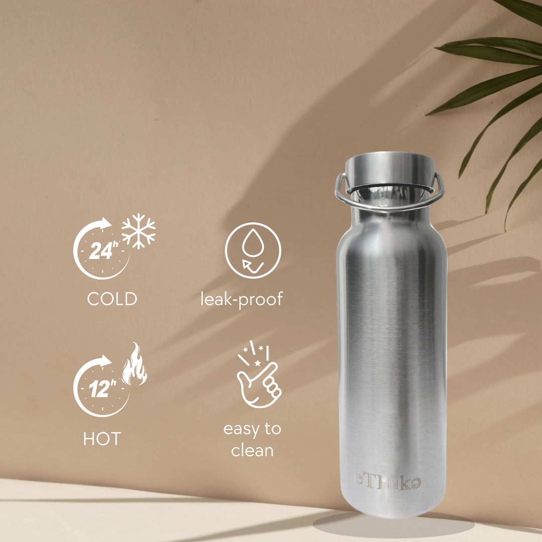 A sleek stainless steel double-walled water bottle with a steel lid, showcasing its stylish design and durable construction.