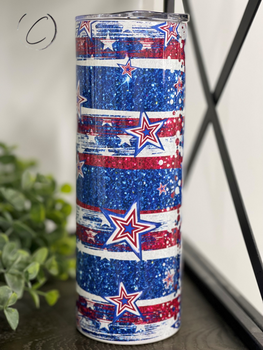 Stars & Stripes 20oz Skinny Tumbler featuring a vibrant patriotic design with a reusable straw.