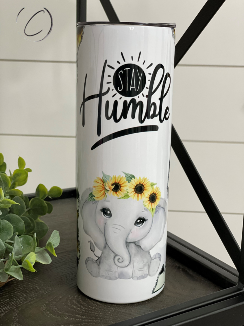 Stay Humble 20oz Skinny Tumbler with a full wrap design, featuring a motivational message and a reusable straw.