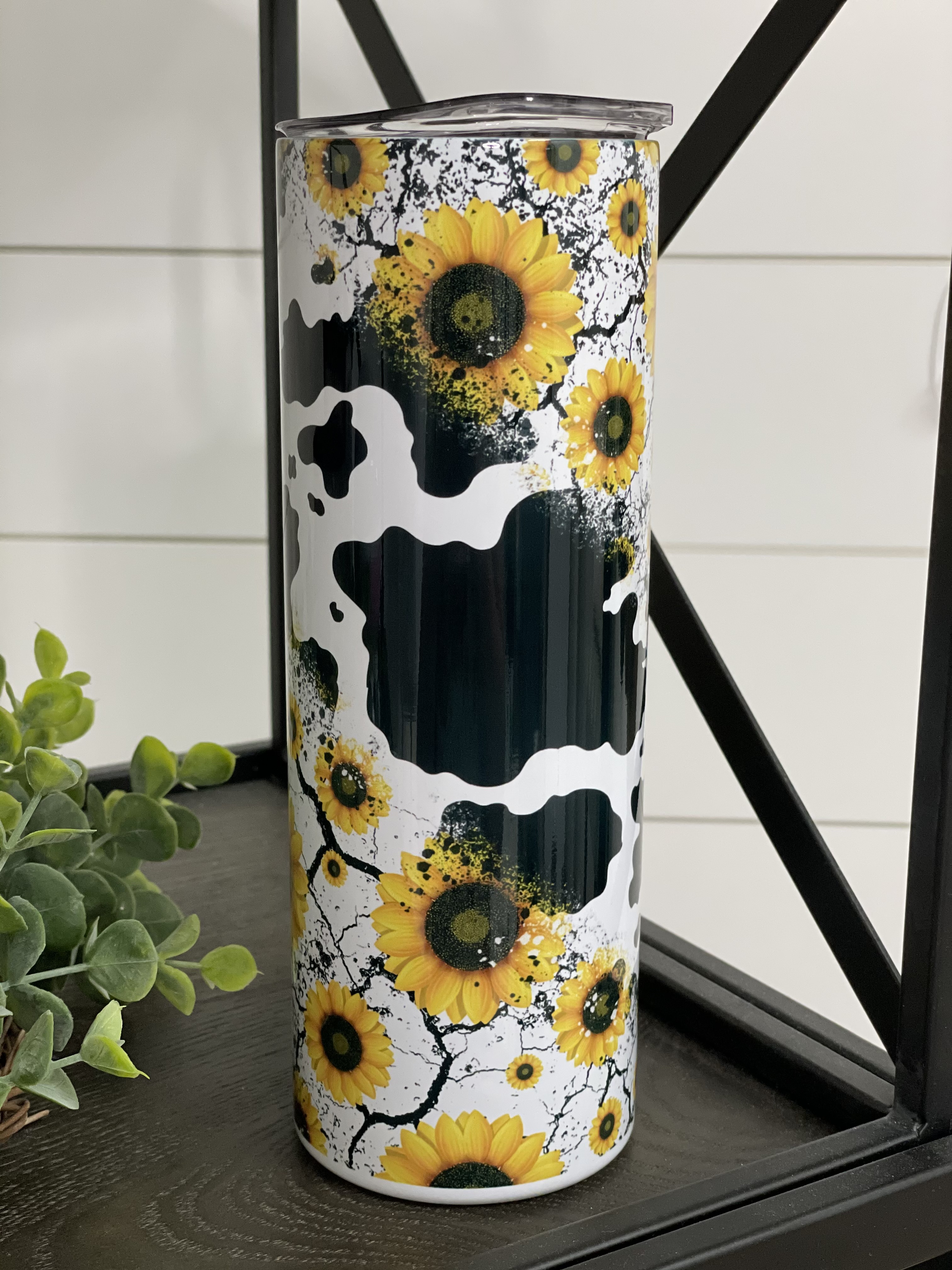 Sunflower Cow 20oz Skinny Tumbler featuring a vibrant sunflower cow design, perfect for drinks on the go.