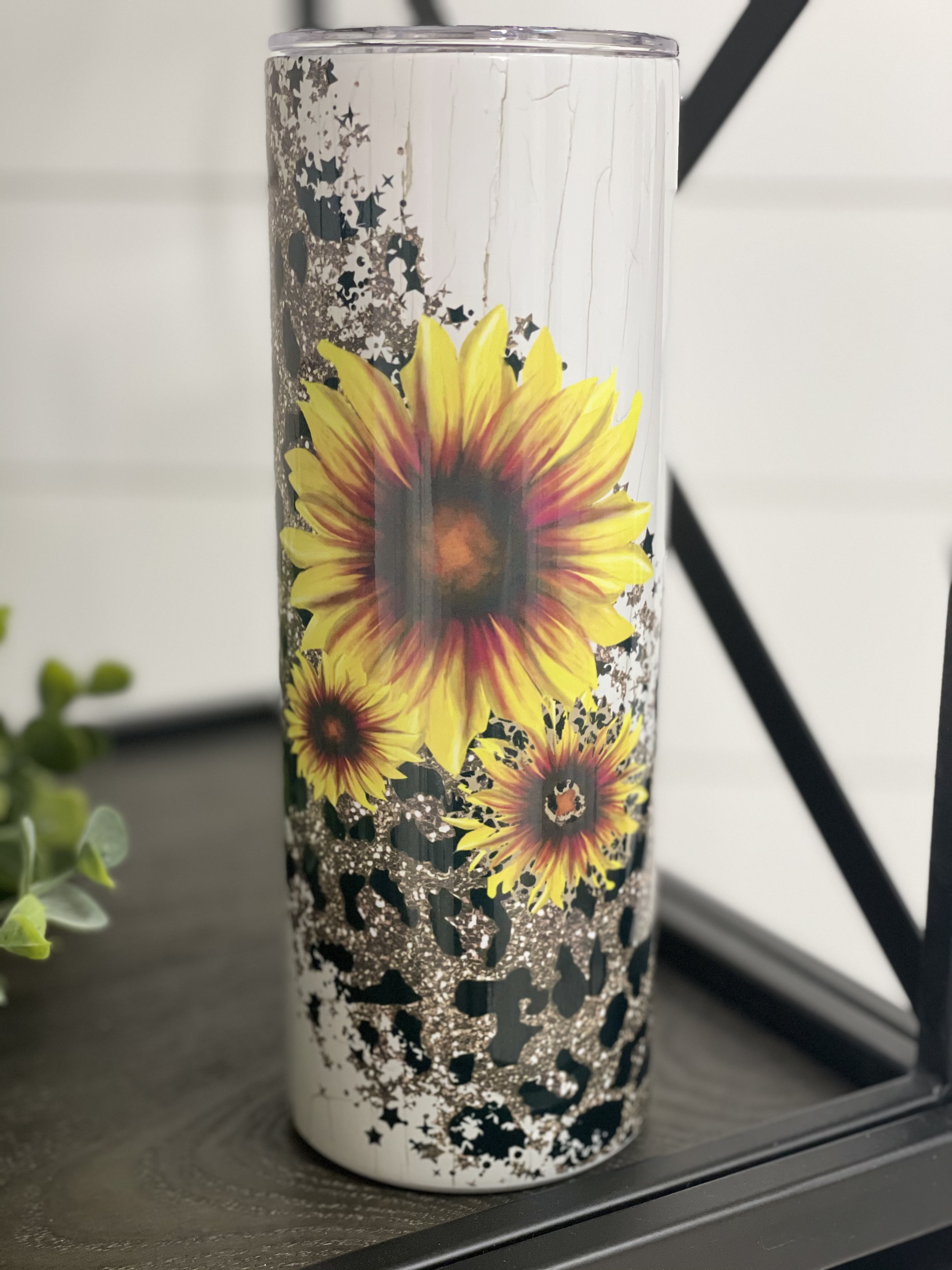 Sunflower Leopard 20oz Skinny Tumbler with vibrant floral and animal print design, featuring a reusable straw.