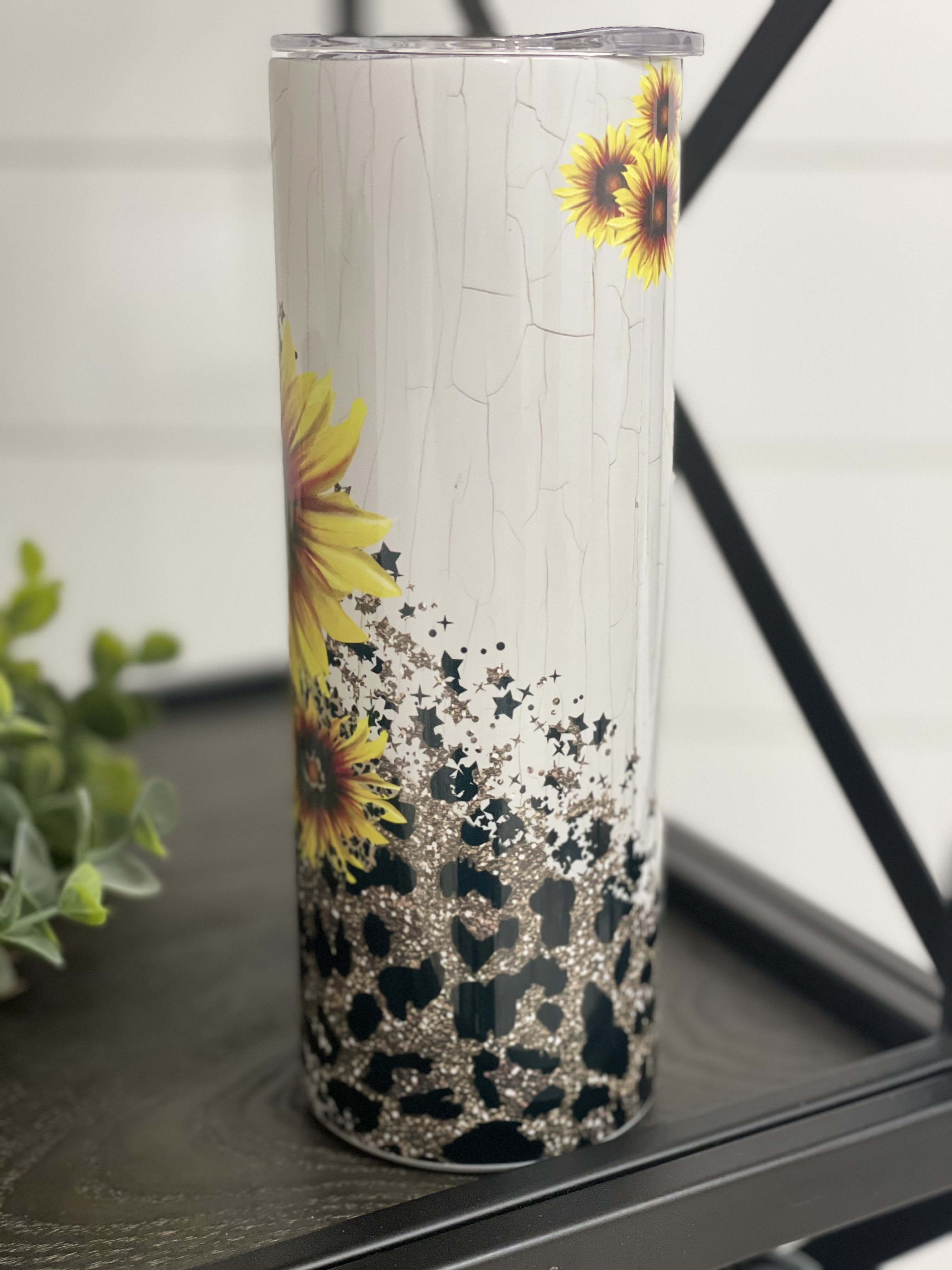 Sunflower Leopard 20oz Skinny Tumbler with vibrant floral and animal print design, featuring a reusable straw.