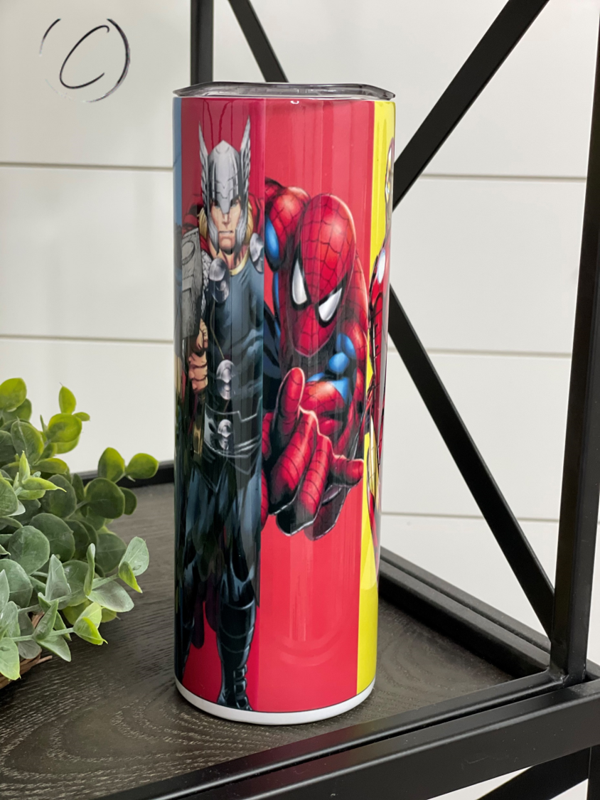 Superheroes 20oz Skinny Tumbler featuring vibrant superhero designs, reusable straw, and insulated body for hot and cold beverages.