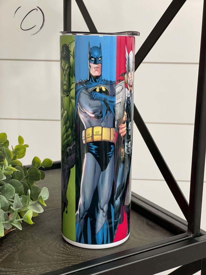 Superheroes 20oz Skinny Tumbler featuring vibrant superhero designs, reusable straw, and insulated body for hot and cold beverages.