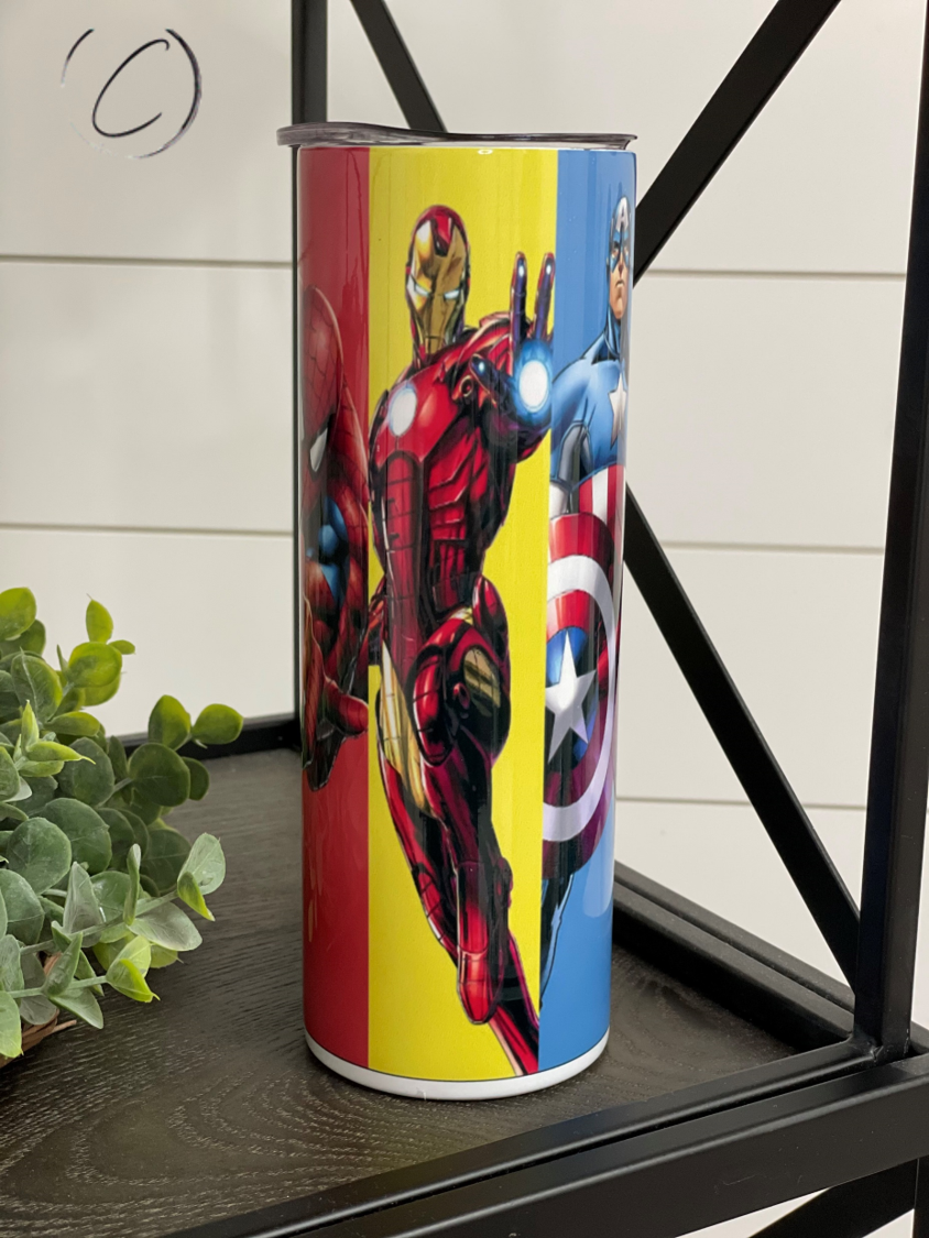 Superheroes 20oz Skinny Tumbler featuring vibrant superhero designs, reusable straw, and insulated body for hot and cold beverages.