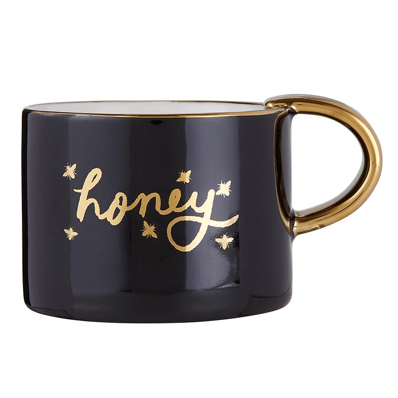 Sweet Like Honey Mug, Tray, and Spoon Set featuring a black ceramic mug with gold lettering, a matching tray, and a gold spoon.