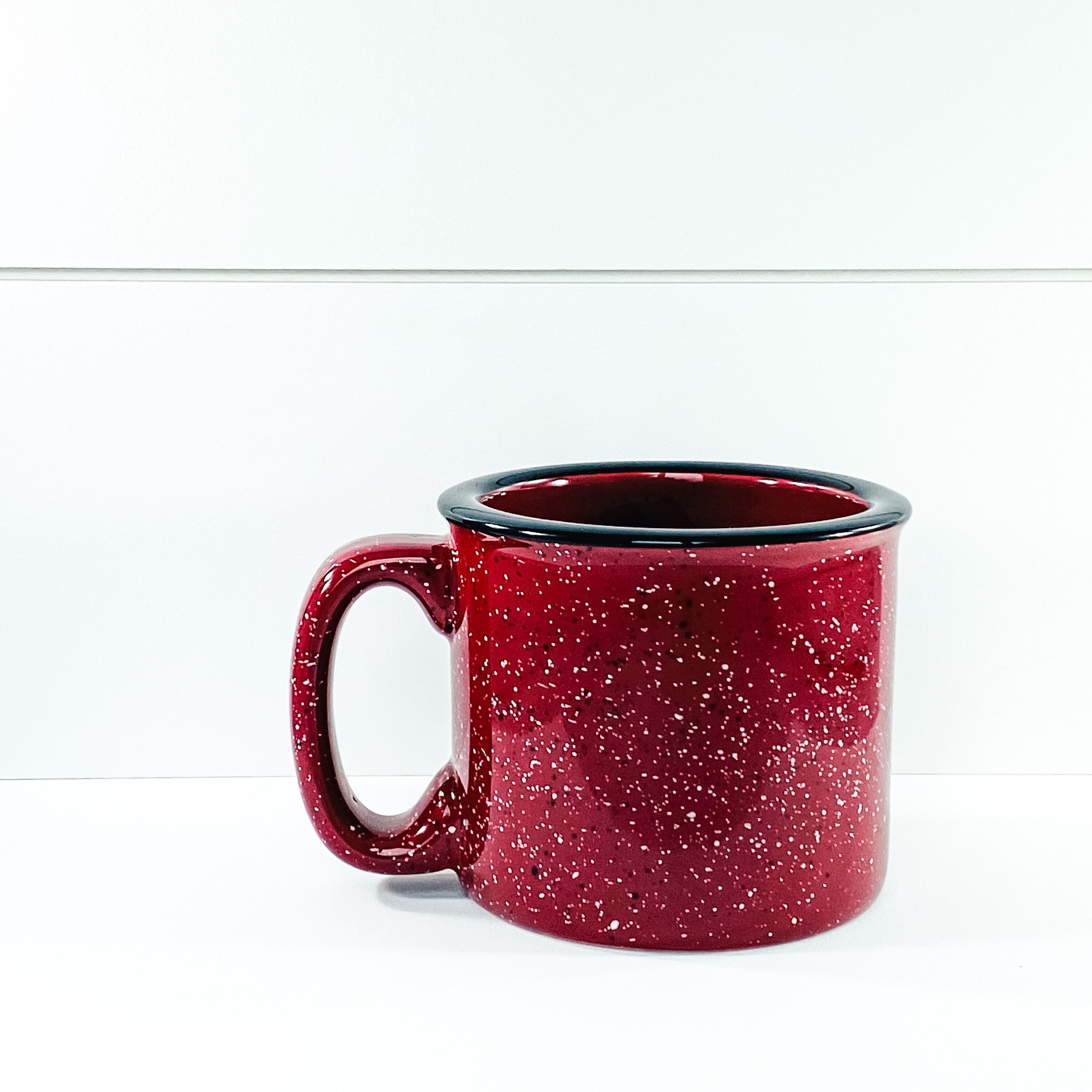 A ceramic coffee mug featuring the phrase 'Thankful Grateful and Blessed' printed on one side, showcasing a stylish design.