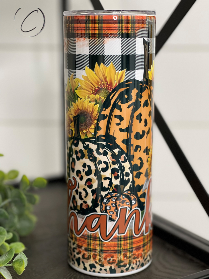 Thankful Pumpkin & Plaid 20oz Skinny Tumbler featuring a vibrant pumpkin and plaid design, perfect for fall beverages.