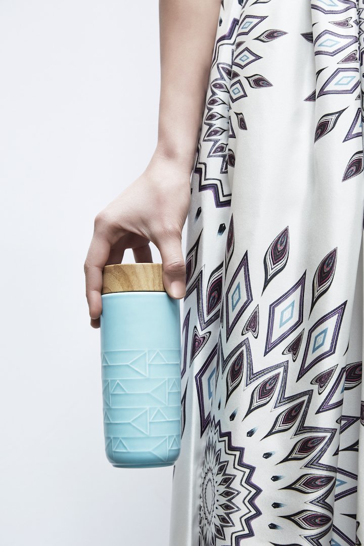 The Alchemical Signs Tumbler featuring vibrant geometric patterns inspired by ancient alchemical symbols, crafted from ceramics with a stylish lid.