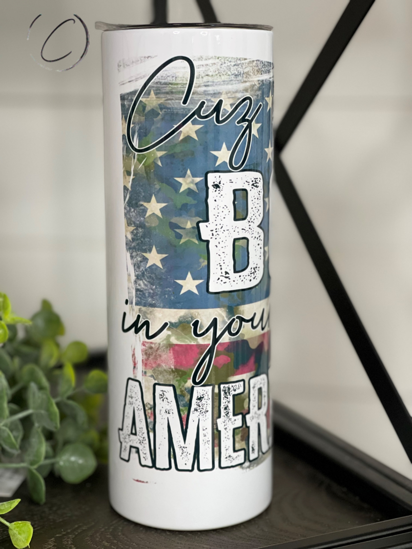 The American Way 20oz Skinny Tumbler featuring a vibrant design, durable construction, and a reusable straw.