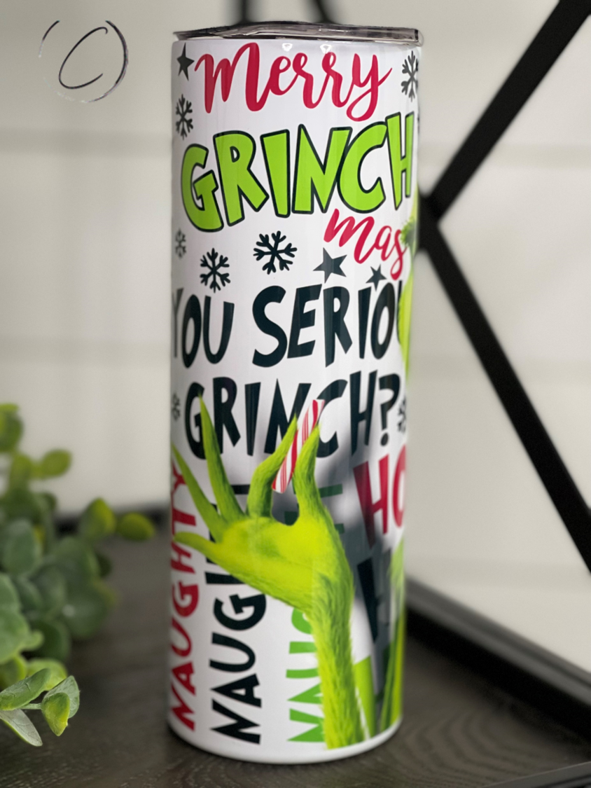 The Grinch 20oz Skinny Tumbler featuring a vibrant design, reusable straw, and durable construction.