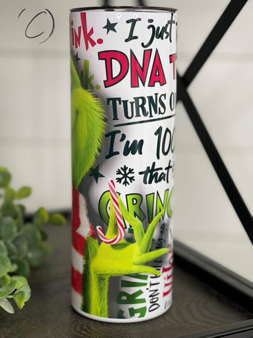 The Grinch 20oz Skinny Tumbler featuring a vibrant design, reusable straw, and durable construction.