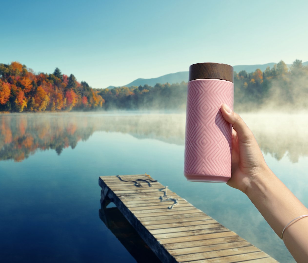 The Miracle Ceramic Tumbler showcasing its elegant design with a bamboo effect lid, featuring a tourmaline lining for enhanced beverage purity.